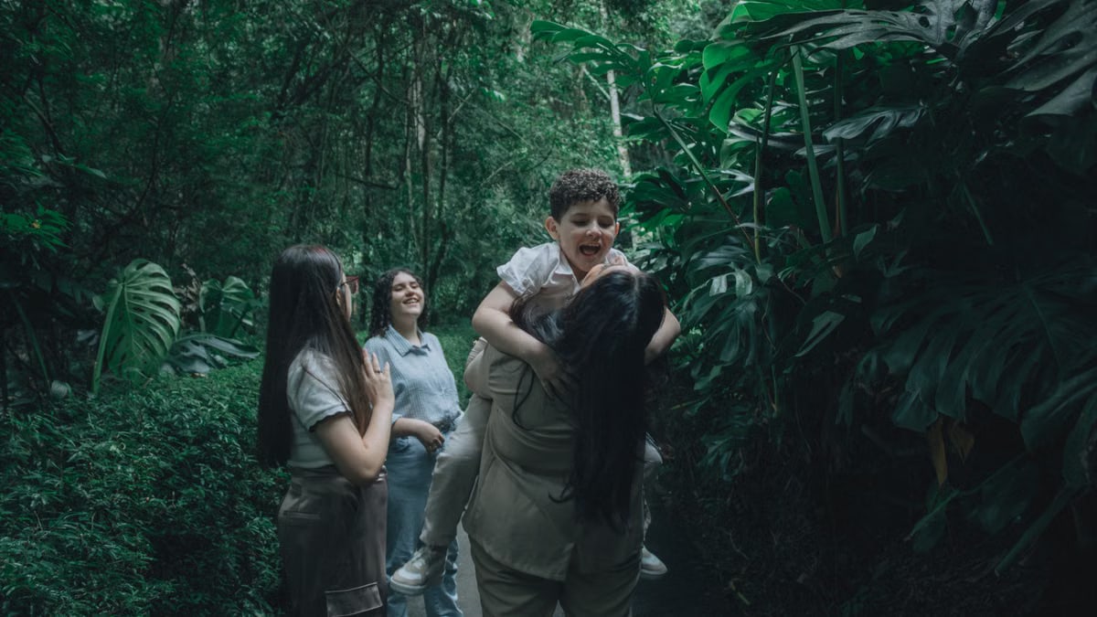 A joyful family bonding in a lush green forest, embracing nature.